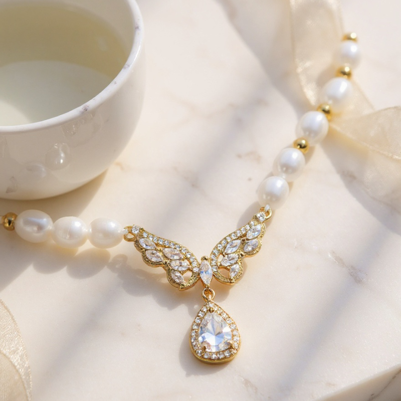 Elegant RosyCozy necklace featuring butterfly teardrop pendant and natural freshwater pearl