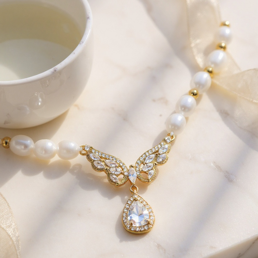 Elegant RosyCozy necklace featuring butterfly teardrop pendant and natural freshwater pearl