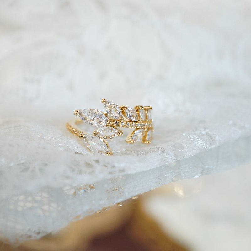 Gold leaf vine ring with marquise-cut zircon gemstones on an 18k gold-plated band