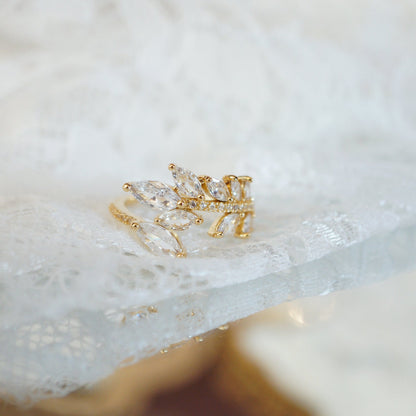 Gold leaf vine ring with marquise-cut zircon gemstones on an 18k gold-plated band