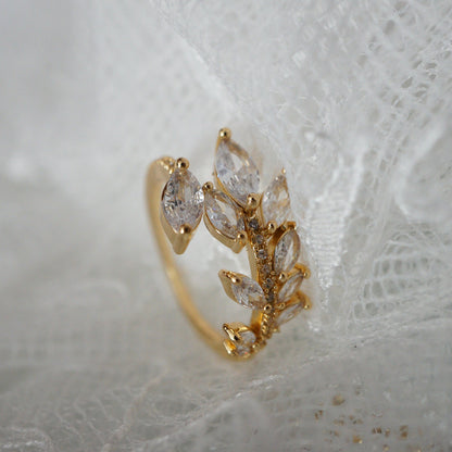 Gold leaf vine ring with marquise-cut zircon gemstones on an 18k gold-plated band