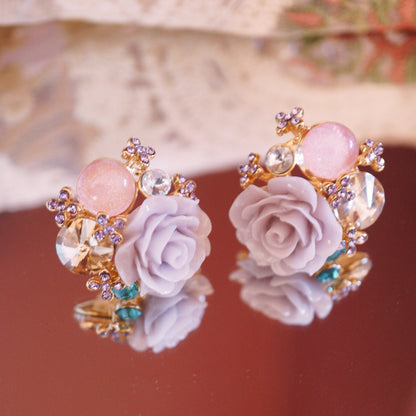 RosyCozy Romantic Rose Blossom Crystal Earrings with pink floral design and gold accents