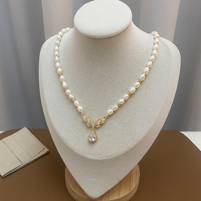 Elegant RosyCozy necklace featuring butterfly teardrop pendant and natural freshwater pearl