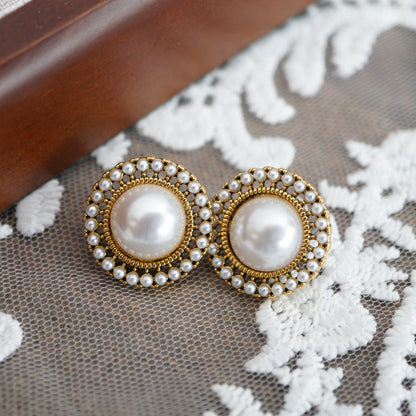 RosyCozy vintage-inspired pearl and gold stud earrings with classic round design