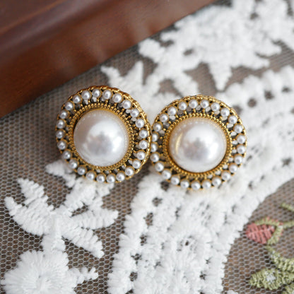 RosyCozy vintage-inspired pearl and gold stud earrings with classic round design