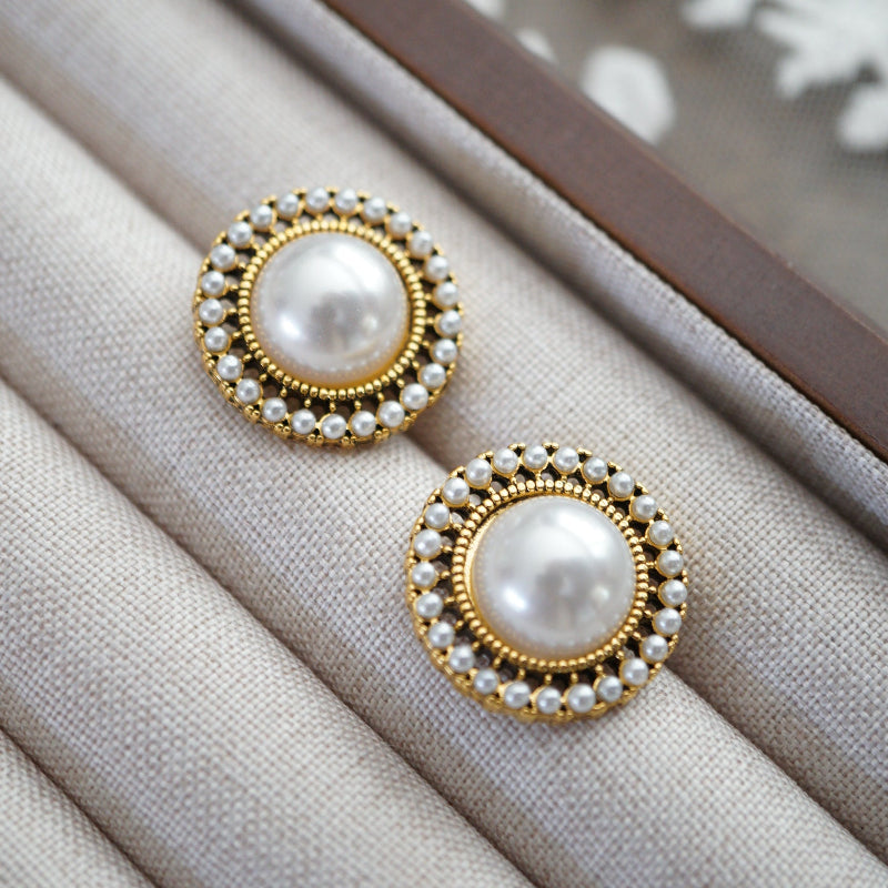 RosyCozy vintage-inspired pearl and gold stud earrings with classic round design