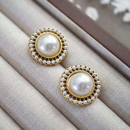 RosyCozy vintage-inspired pearl and gold stud earrings with classic round design